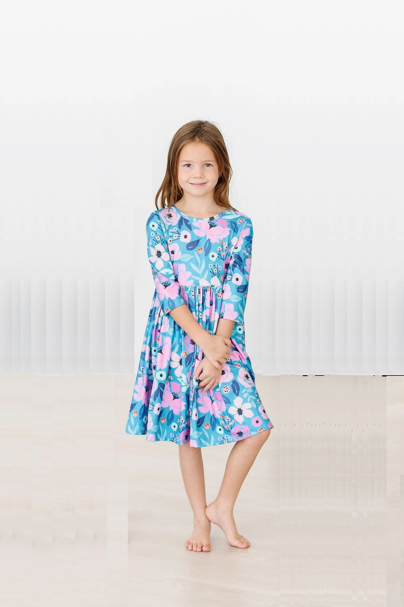 Girls Twirling in Teal Dress