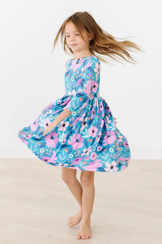 Girls Twirling in Teal Dress