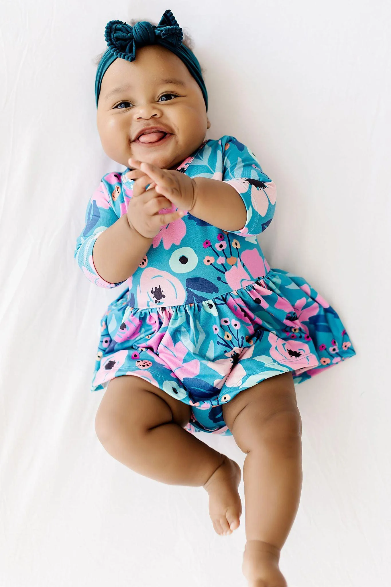 Baby Twirling in Teal Bodysuit